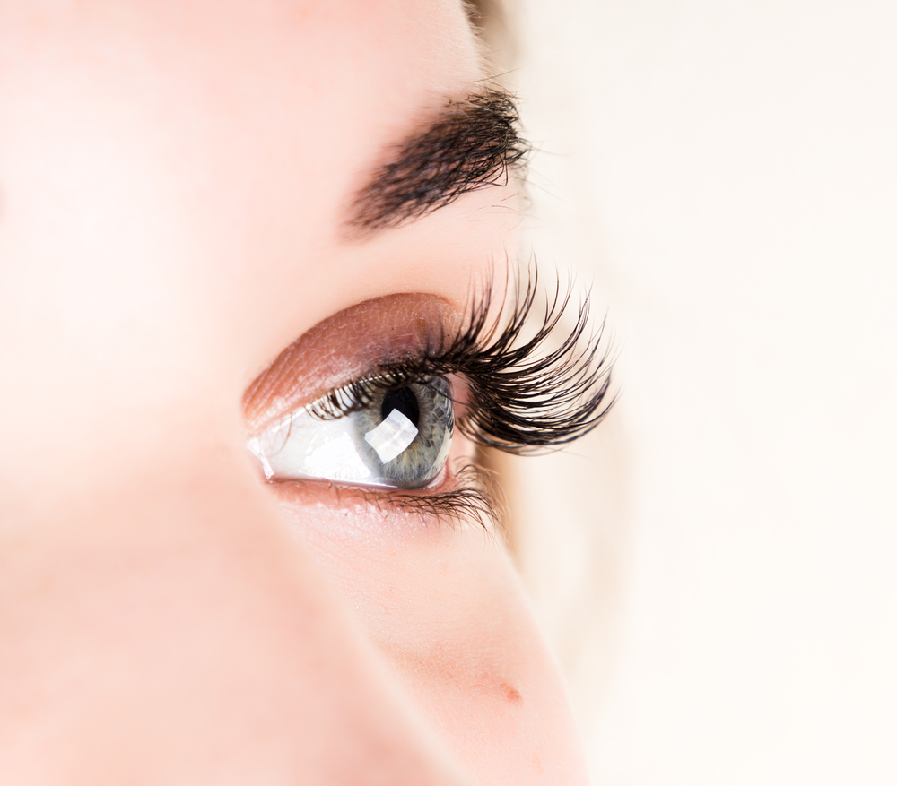 Close-up of an eye with long, full lashes